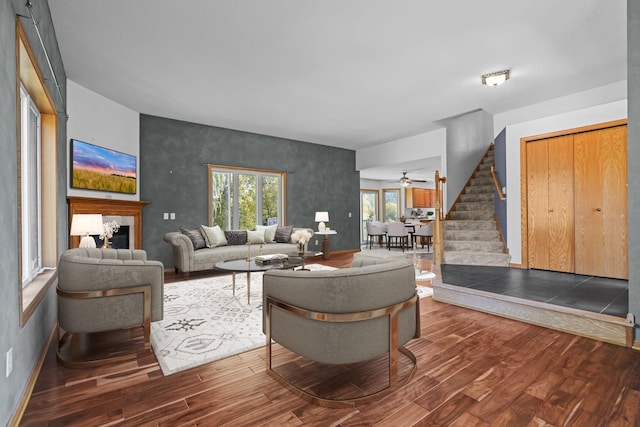 living room with ceiling fan and hardwood / wood-style floors