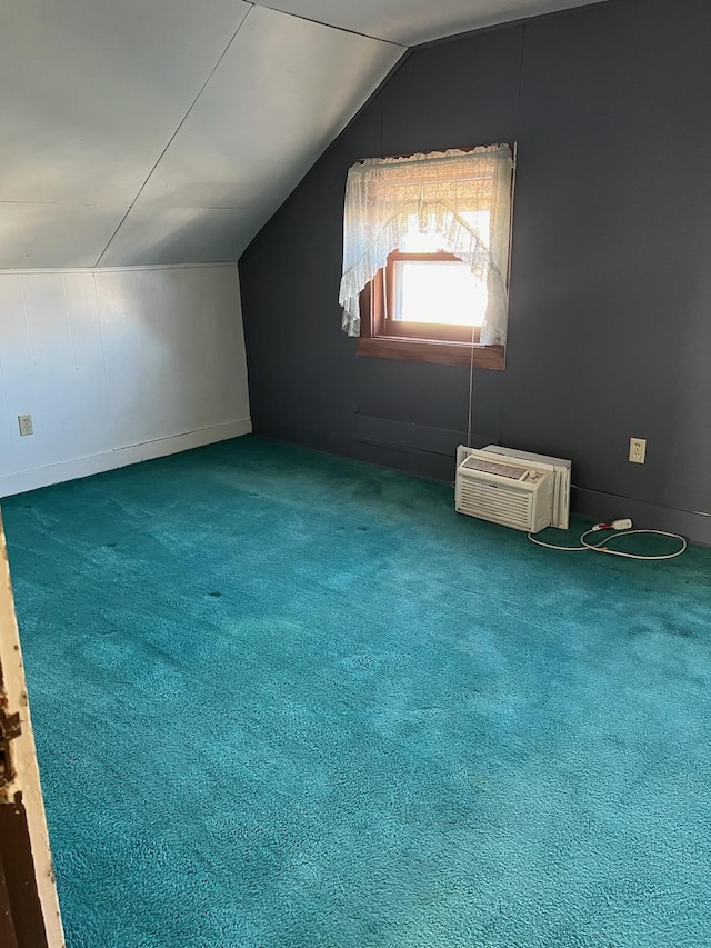 721 5th Ave E, Alexandria, MN 56308 - additional living space featuring lofted ceiling, a wall mounted AC, and carpet flooring