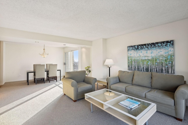 living room with a textured ceiling and carpet flooring