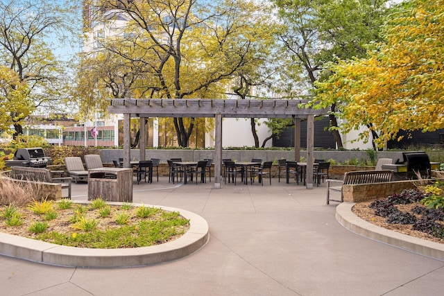 view of community with a patio, a bar, and a pergola