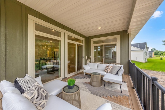 view of patio featuring outdoor lounge area and a balcony