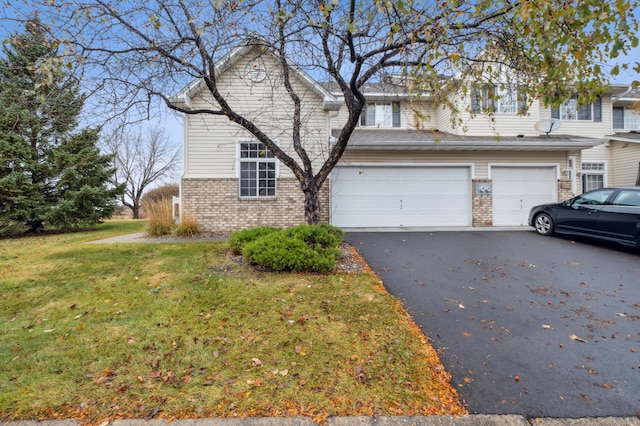 front of property with a garage and a front yard