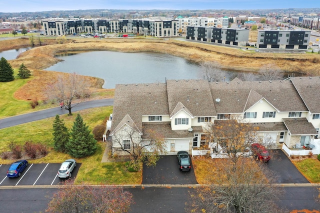 birds eye view of property with a water view