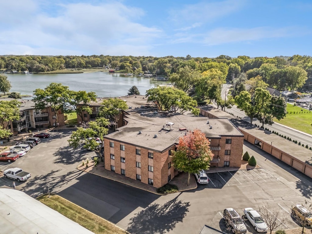 birds eye view of property with a water view