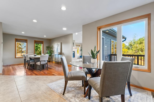 dining room featuring light hardwood / wood-style flooring and a wealth of natural light