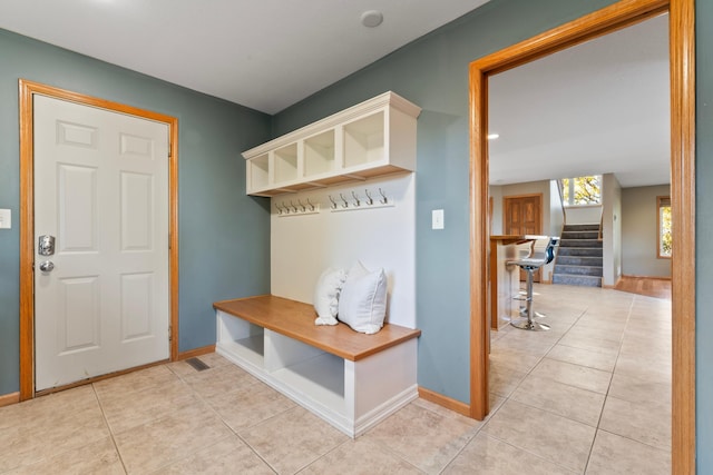 mudroom with light tile patterned flooring