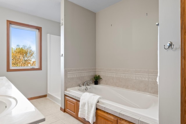 bathroom with vanity, shower with separate bathtub, and tile patterned flooring