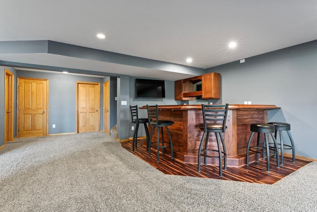 bar featuring dark colored carpet