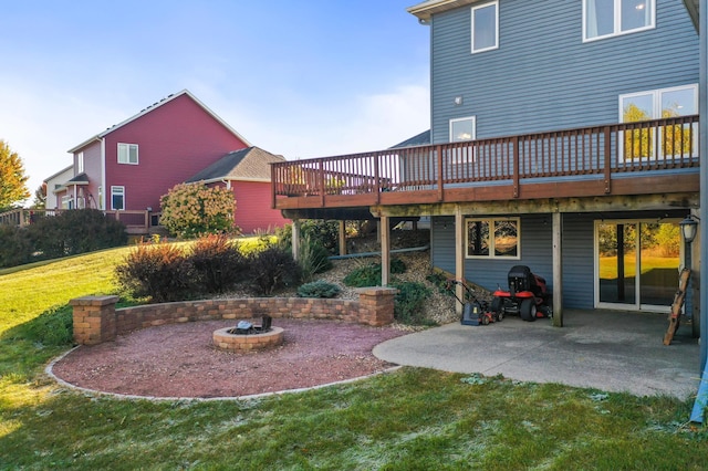 exterior space with a wooden deck, a patio area, and a yard