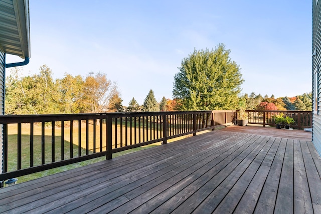 wooden deck with a yard