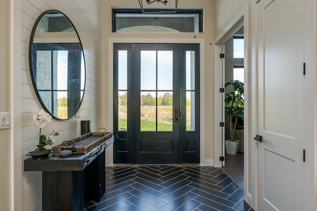 foyer entrance with dark hardwood / wood-style flooring