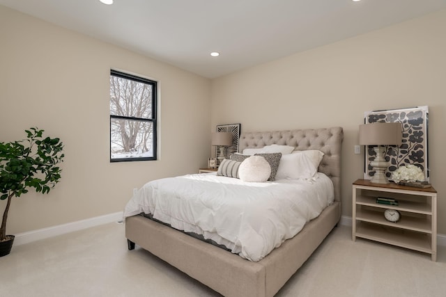 bedroom featuring light colored carpet