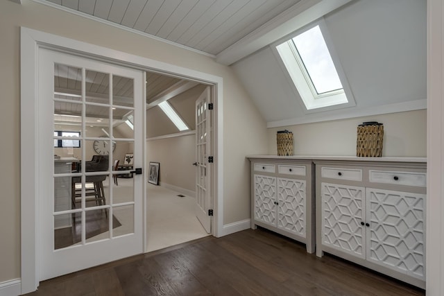 interior space with dark hardwood / wood-style floors, wood ceiling, and lofted ceiling with skylight