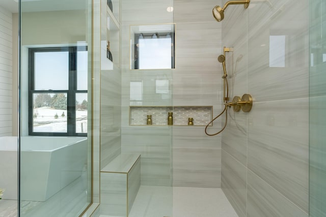 bathroom with a tile shower