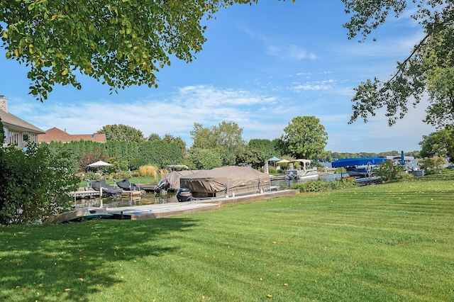 view of yard with a boat dock