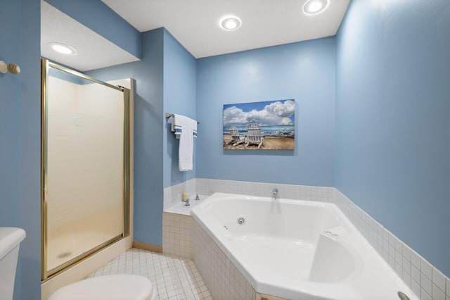 full bathroom featuring tile patterned floors, toilet, a bath, and a stall shower