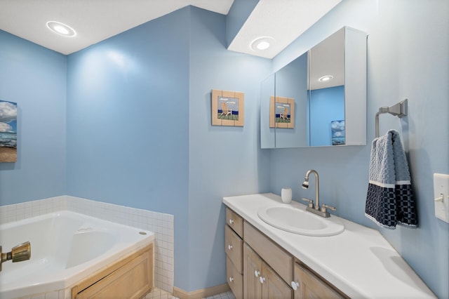 bathroom with a bath and vanity