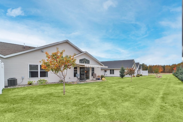 rear view of property with cooling unit, a yard, a pergola, and a patio