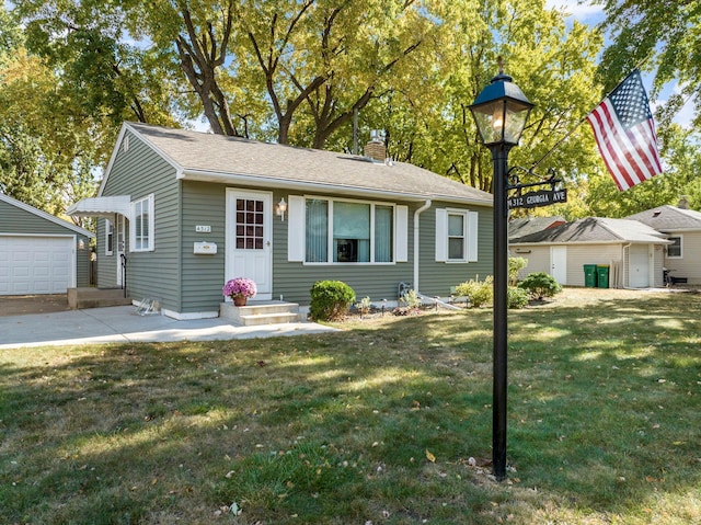 view of front facade featuring entry steps, an outbuilding, a front lawn, and a chimney