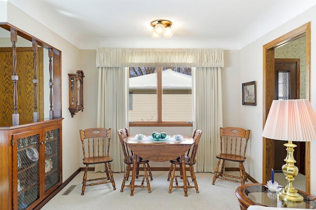 4312 Georgia Ave N, Crystal, MN 55428 - carpeted dining space featuring visible vents, plenty of natural light, and baseboards