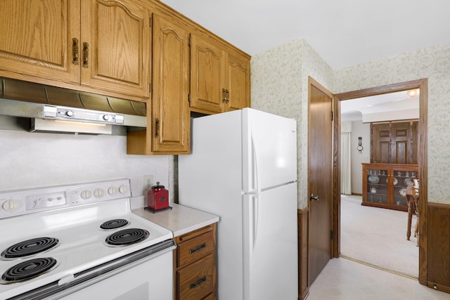 4312 Georgia Ave N, Crystal, MN 55428 - kitchen with under cabinet range hood, white appliances, and wallpapered walls