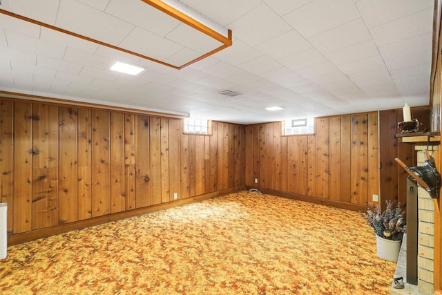 4312 Georgia Ave N, Crystal, MN 55428 - basement with baseboards, carpet floors, visible vents, and wood walls