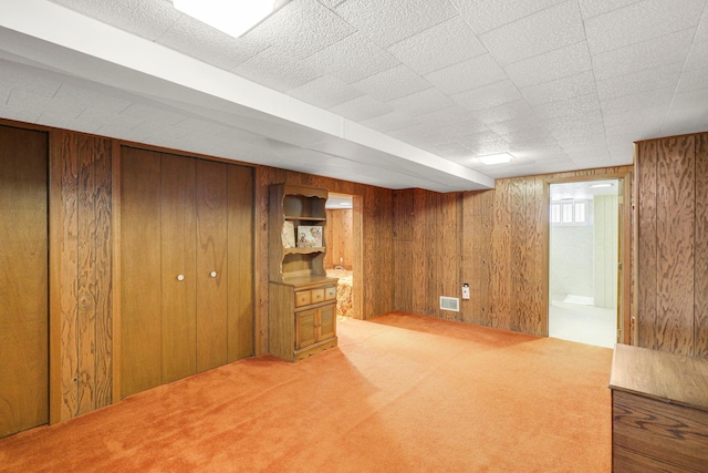 4312 Georgia Ave N, Crystal, MN 55428 - finished basement with visible vents, wooden walls, and carpet