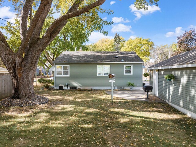 4312 Georgia Ave N, Crystal, MN 55428 - back of property featuring central AC unit, fence, a yard, crawl space, and a patio area