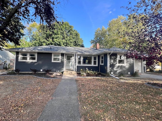 712 11th St, Montevideo, MN 56265 - single story home with an attached garage and a chimney