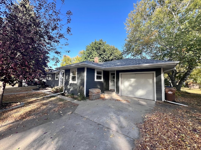 712 11th St, Montevideo, MN 56265 - single story home with an attached garage, a chimney, and driveway