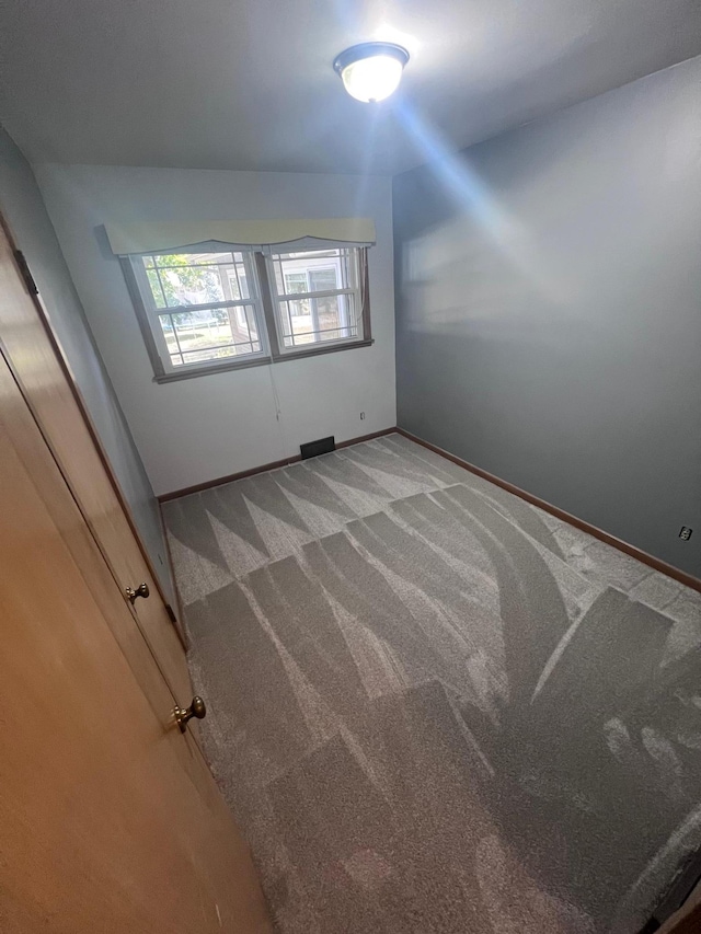 712 11th St, Montevideo, MN 56265 - empty room featuring carpet floors and baseboards