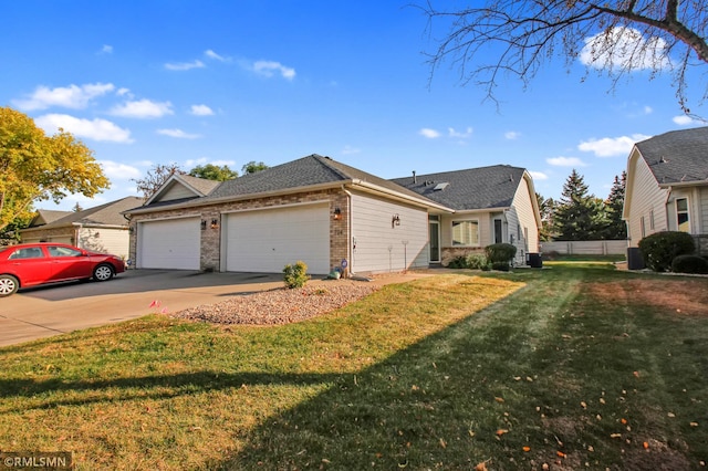 view of front facade featuring a garage and a front lawn