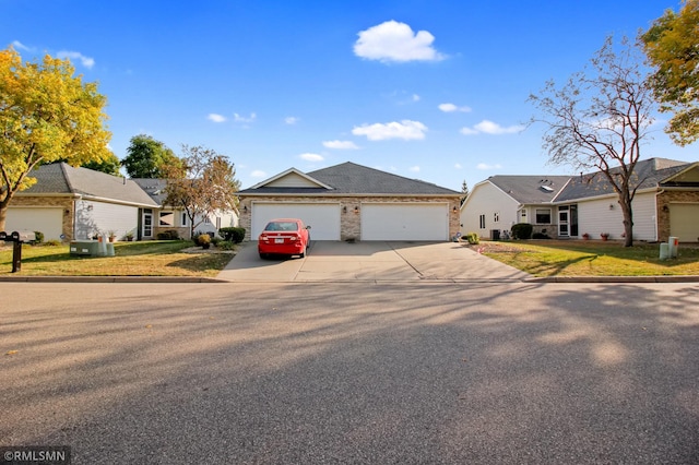 single story home with a front lawn and a garage