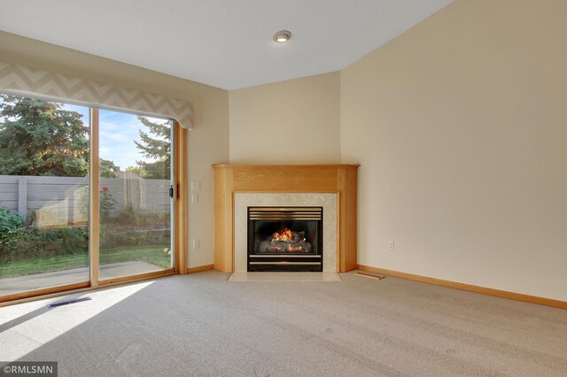 unfurnished living room featuring carpet floors