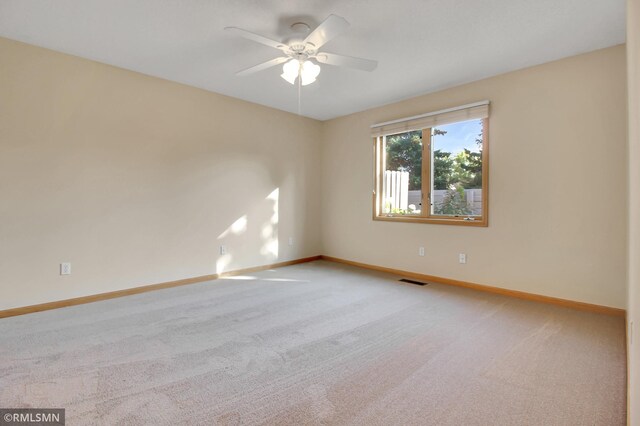 carpeted empty room with ceiling fan