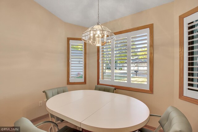 dining area with a notable chandelier