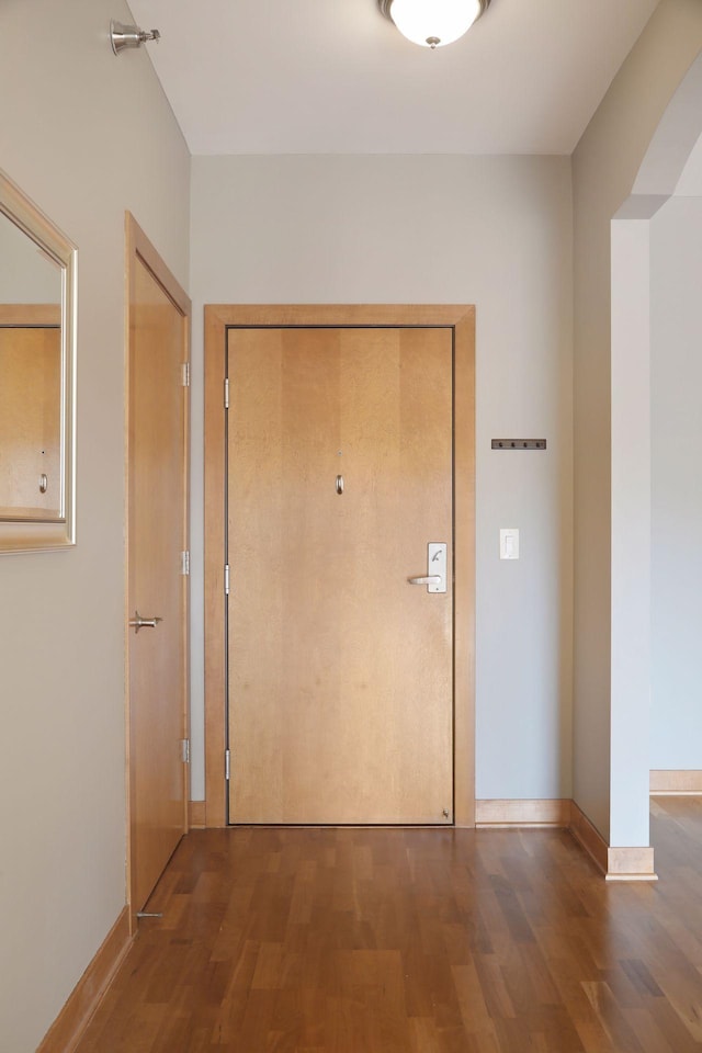 interior space with dark hardwood / wood-style floors