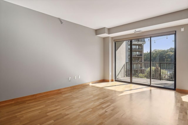 unfurnished room with light hardwood / wood-style flooring