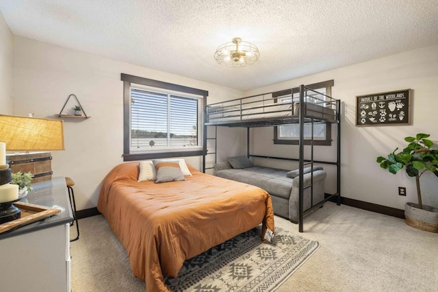 carpeted bedroom with a textured ceiling