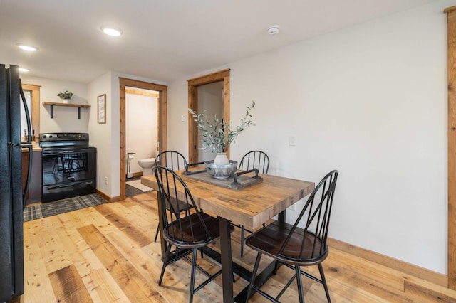 dining room with light hardwood / wood-style flooring