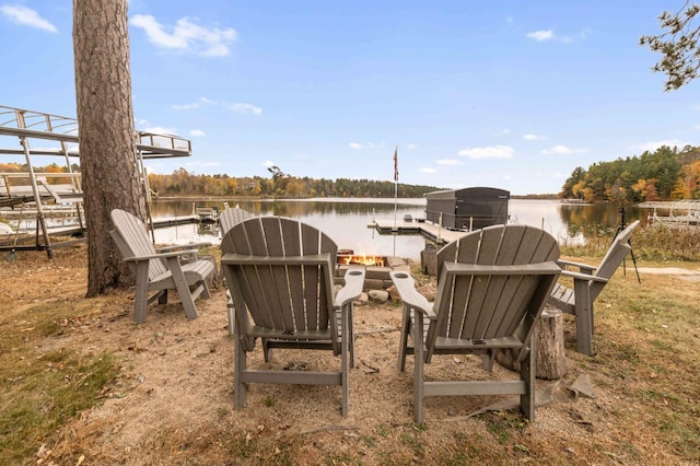 view of patio / terrace featuring a dock and a water view