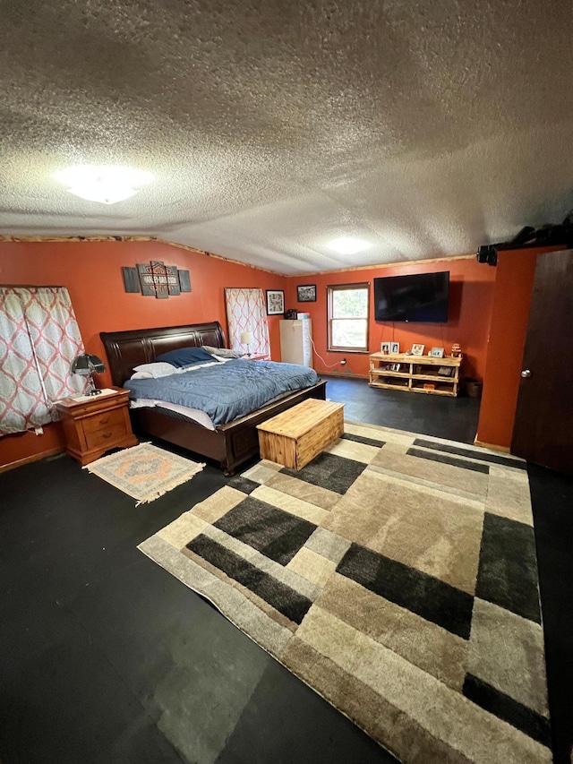 bedroom with a textured ceiling and vaulted ceiling