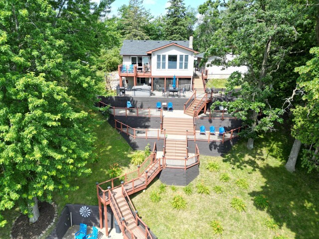 back of house featuring a wooden deck