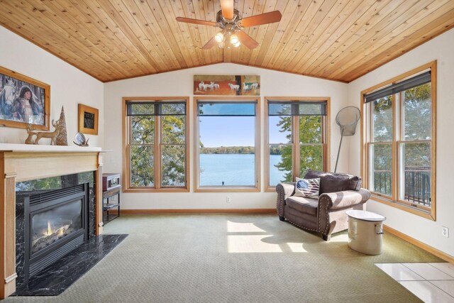 interior space with a water view, light carpet, wood ceiling, lofted ceiling, and a fireplace