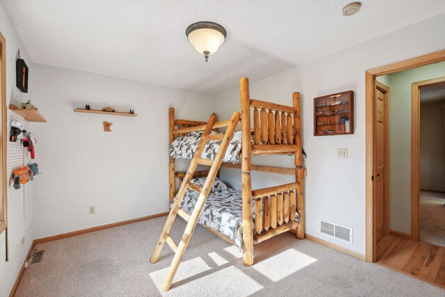 bedroom with light carpet