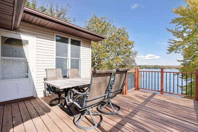 wooden terrace with a water view