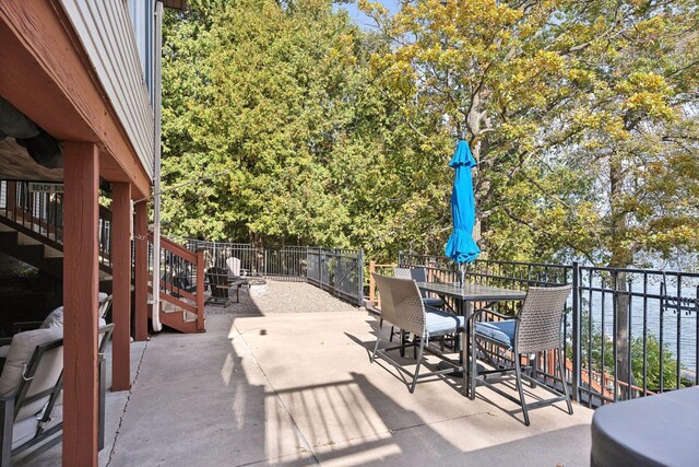 view of patio with a water view