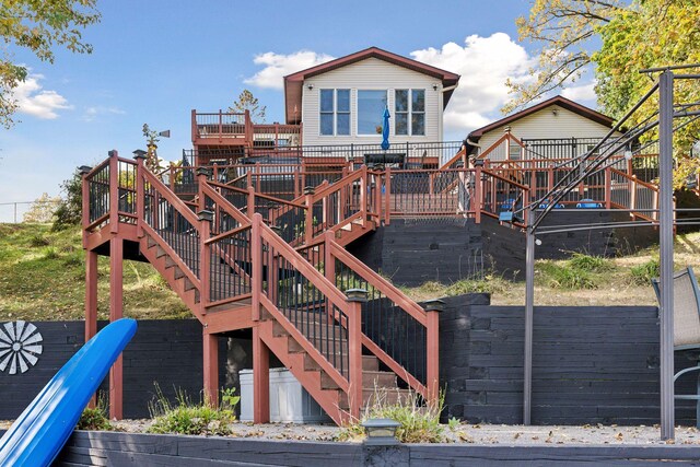 view of playground with a deck