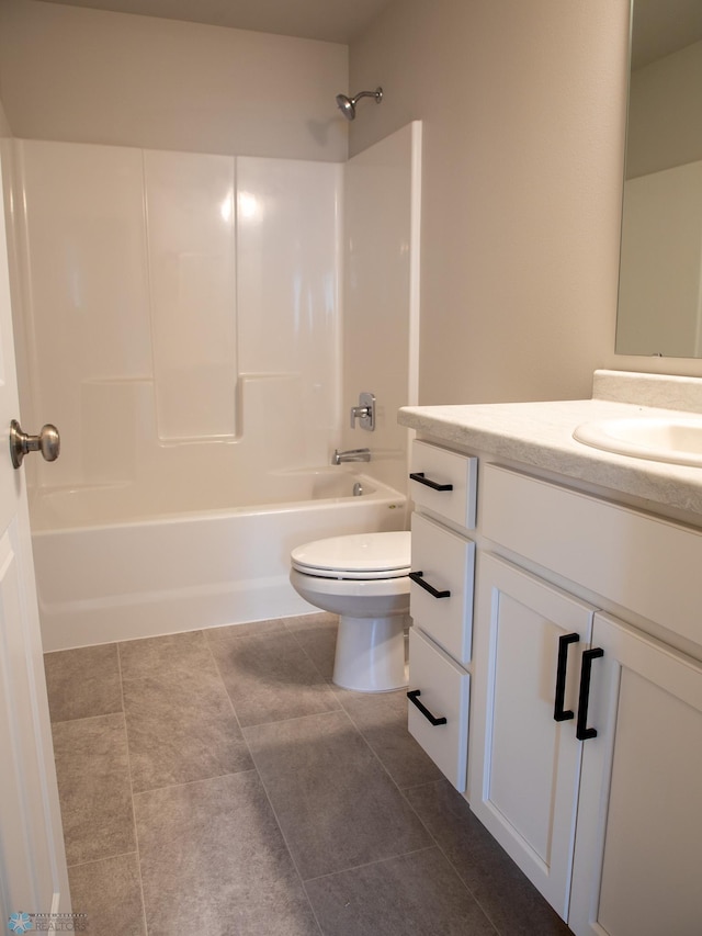 full bathroom featuring tile patterned floors, vanity, toilet, and shower / tub combination