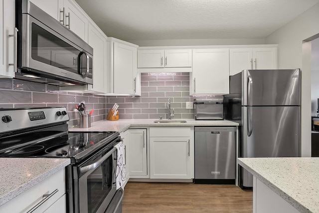 kitchen with white cabinets and stainless steel appliances